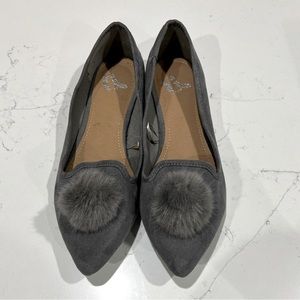 Pointy flats with puff ball